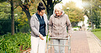 Senior woman, walker and nurse outdoor in a park with healthcare for elderly exercise. Walking, healthcare professional and female person with peace and physical therapy in a public garden with carer