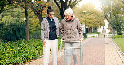 Senior woman, walker and nurse outdoor in a park with healthcare for elderly exercise. Walking, healthcare professional and female person with peace and physical therapy in a public garden with carer