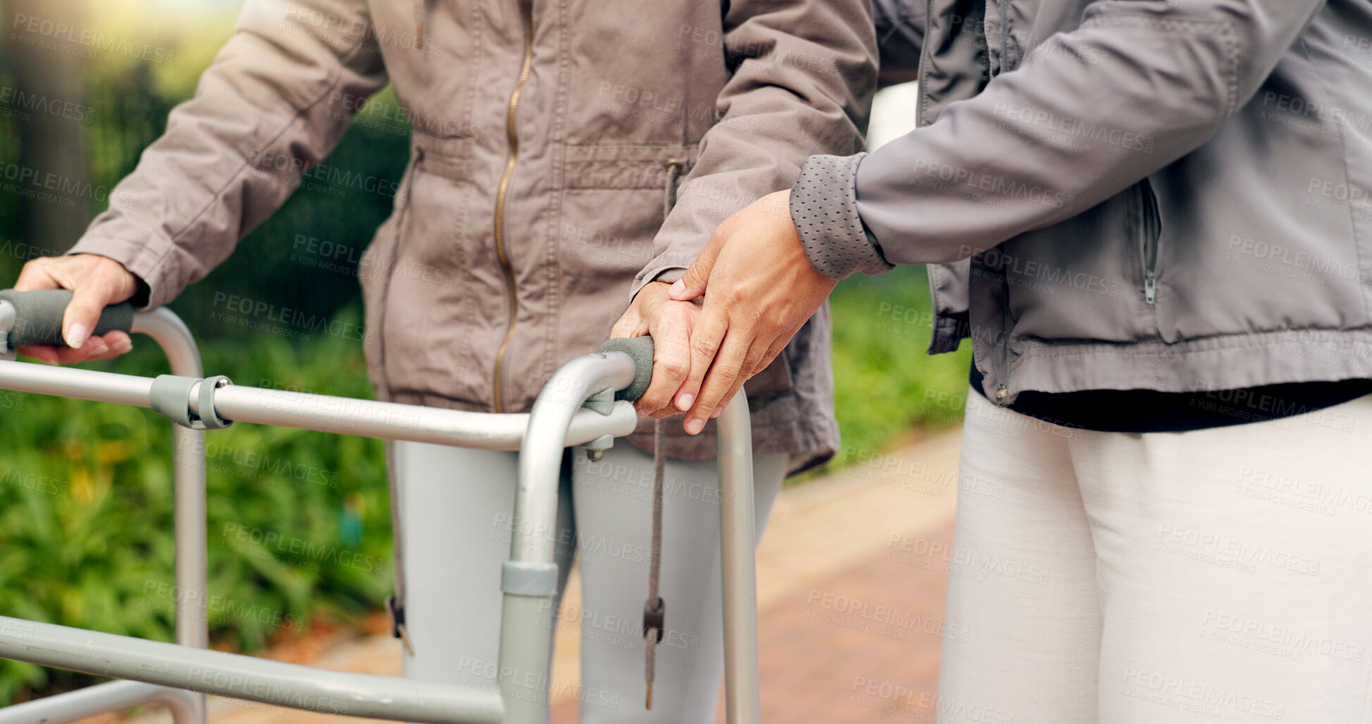 Buy stock photo People, support and walking frame in park or outdoor wellness, exercise and physiotherapy. Person with disability in garden or nature with helping hands for physical therapy, muscle fitness or cardio