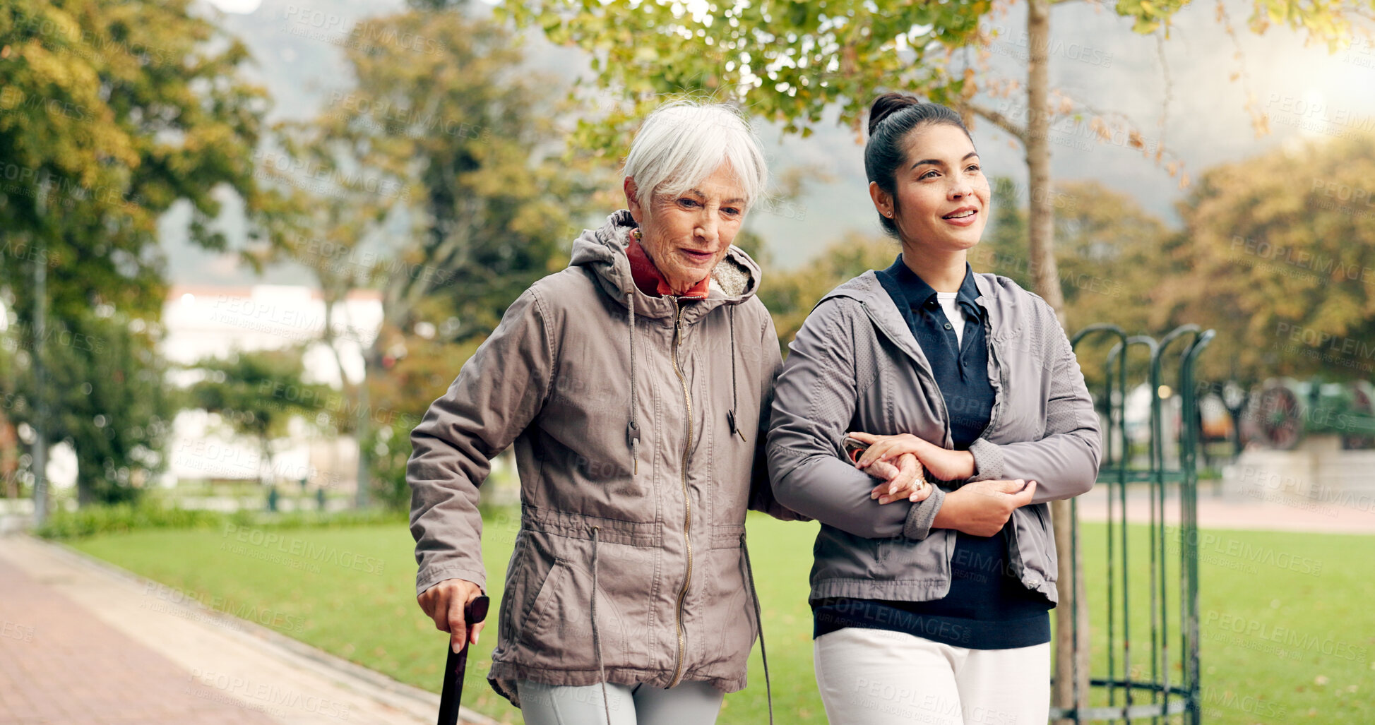 Buy stock photo Senior woman, walker and nurse talking in a park with healthcare for elderly exercise. Walking, healthcare professional and female person with peace and physical therapy in a public garden with carer