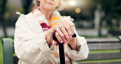 Walking stick, hands and senior woman closeup on a park bench with person with disability. Mobility support, wellness and balance with cane and elderly female person outdoor in a public garden