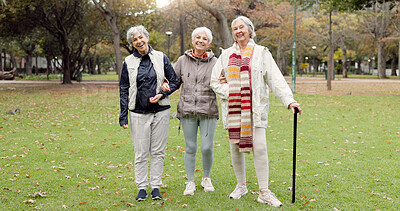 Smile, retirement and senior friends in the park, laughing together while standing on a field of grass. Portrait, freedom and comedy with a group of elderly women in a garden for fun or humor