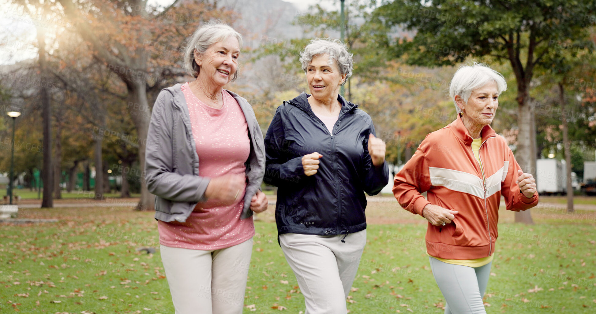 Buy stock photo Senior women, walking and friends with fitness, wellness and workout for health in retirement. Park, exercise and elderly female group with motivation and power walk for cardio outdoor together