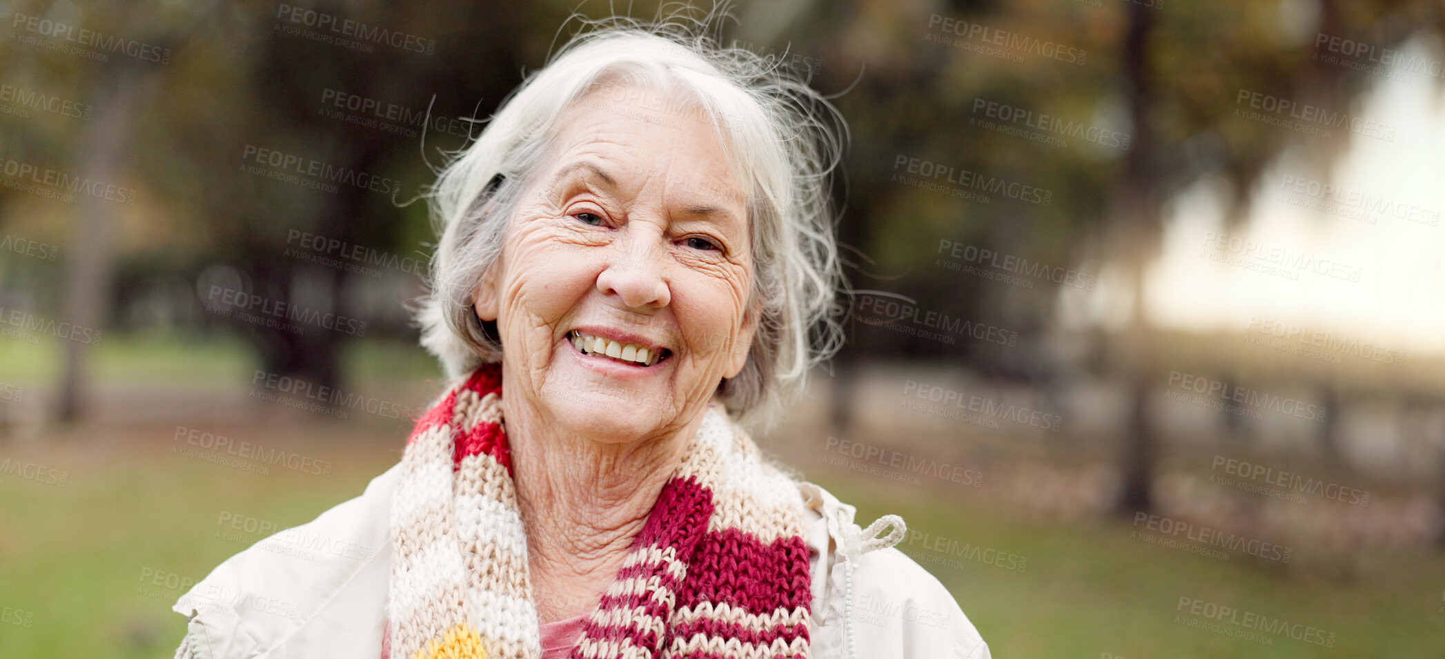 Buy stock photo Senior woman with a smile, portrait in the park and happiness in nature, woods or outdoor for a walk in retirement. Happy, face and elderly person with wellness from exercise or healthy workout