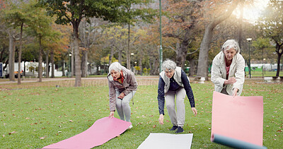 Senior friends, walking and talking with yoga mats in the park to relax in nature with elderly women in retirement. People, happy conversation and healthy outdoor exercise or pilates in winter