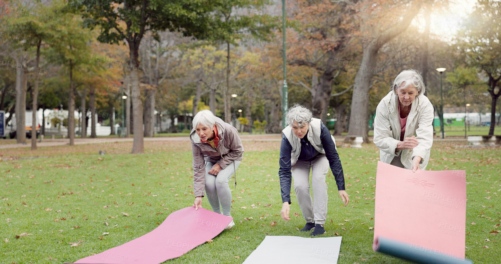 Buy stock photo Senior friends, walking and talking with yoga mats in the park to relax in nature with elderly women in retirement. People, happy conversation and healthy outdoor exercise or pilates in winter