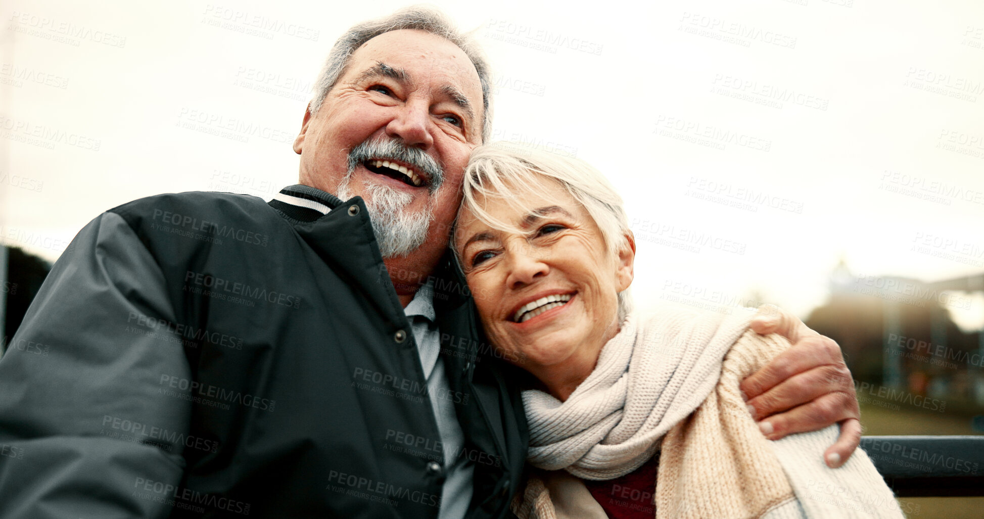 Buy stock photo Retirement, hug and Senior couple on bench at park with happiness or bond for quality time. Love, happy face and  elderly woman or man in nature with support or embrace for trust or laugh together.