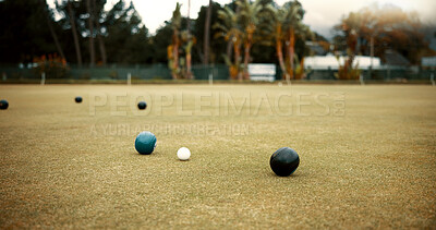 Buy stock photo Green, lawn bowling and balls on grass, field or pitch in a match, game or competition of outdoor bowls. Ball, sport and tournament at a bowlers club, league or championship games on the ground