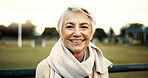 Face, senior woman and smile on park bench on vacation, holiday or travel in winter. Portrait, happy and elderly person in nature, outdoor or garden for freedom to relax for retirement in Australia