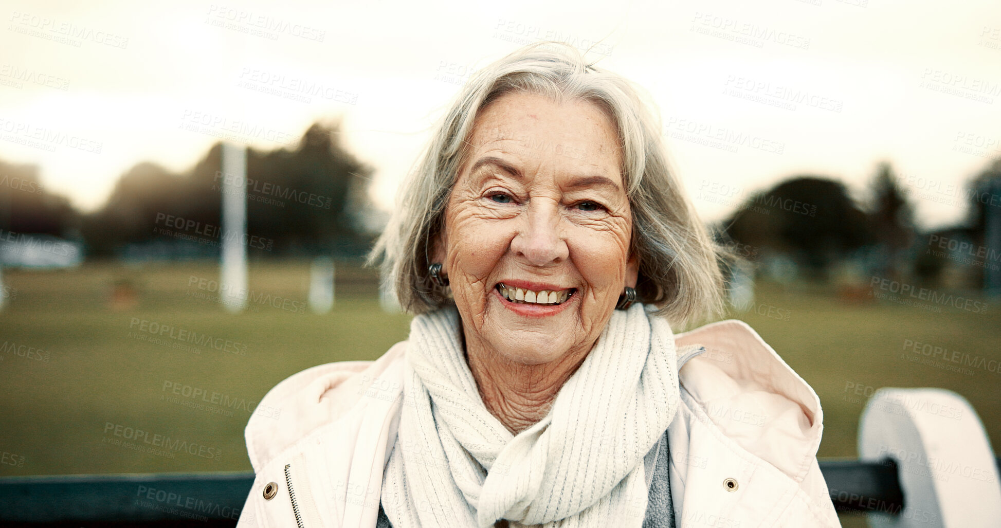 Buy stock photo Face, senior woman and smile on park bench on vacation, holiday or travel in winter. Portrait, happy and elderly person in nature, garden or outdoor for wellness, freedom and relax in retirement