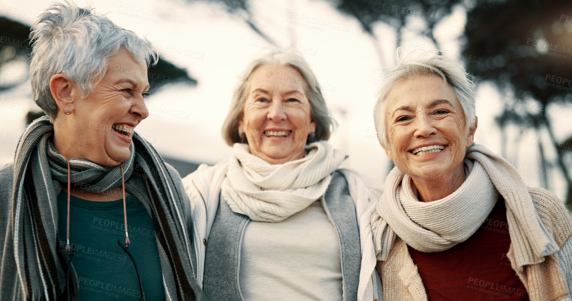 Buy stock photo Talking, laughing and elderly woman friends outdoor in a park together for bonding during retirement. Happy, smile and funny with a group of senior people hugging in a garden for humor or fun