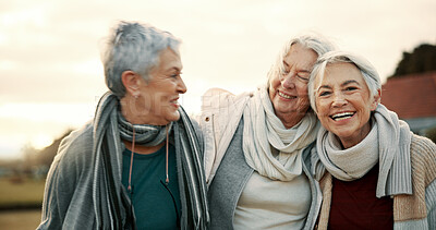 Comedy, laughing and senior woman friends outdoor in a park together for bonding during retirement. Portrait, smile and funny with a happy group of elderly people bonding in a garden for humor or fun