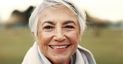 Face, senior woman and smile in nature on vacation, holiday or travel in winter. Portrait, happy and elderly person in the countryside, park or garden for wellness, freedom or retirement in Canada