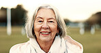 Face, elderly woman and happy in nature on vacation, holiday or travel in winter. Portrait, smile and person in the countryside, park or garden for wellness, freedom and wind in hair in retirement