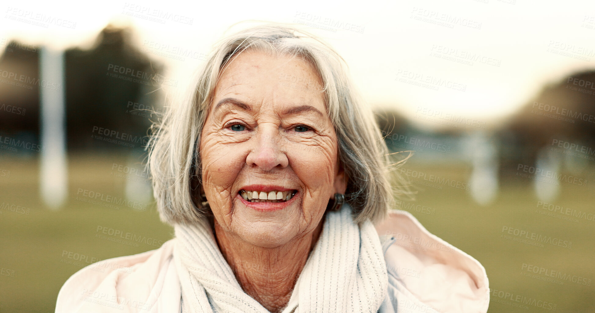 Buy stock photo Face, elderly woman and happy in nature on vacation, holiday or travel in winter. Portrait, smile and person in the countryside, park or garden for wellness, freedom and wind in hair in retirement