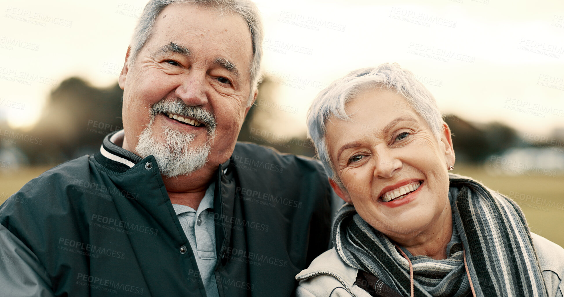 Buy stock photo Face, smile and happy with a senior couple outdoor in a park together for a romantic date during retirement. Portrait, love or care with an elderly man and woman bonding in a garden for romance