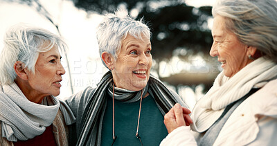 Talking, laughing and senior woman friends outdoor in a park together for bonding during retirement. Happy, smile and funny with a group of elderly people chatting in a garden for humor or fun