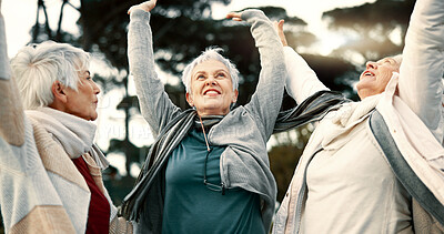 Fitness, park or senior women in huddle, training or exercise for wellness, solidarity or teamwork outdoors. Happy ladies, group success or elderly friends raising arms for workout support together