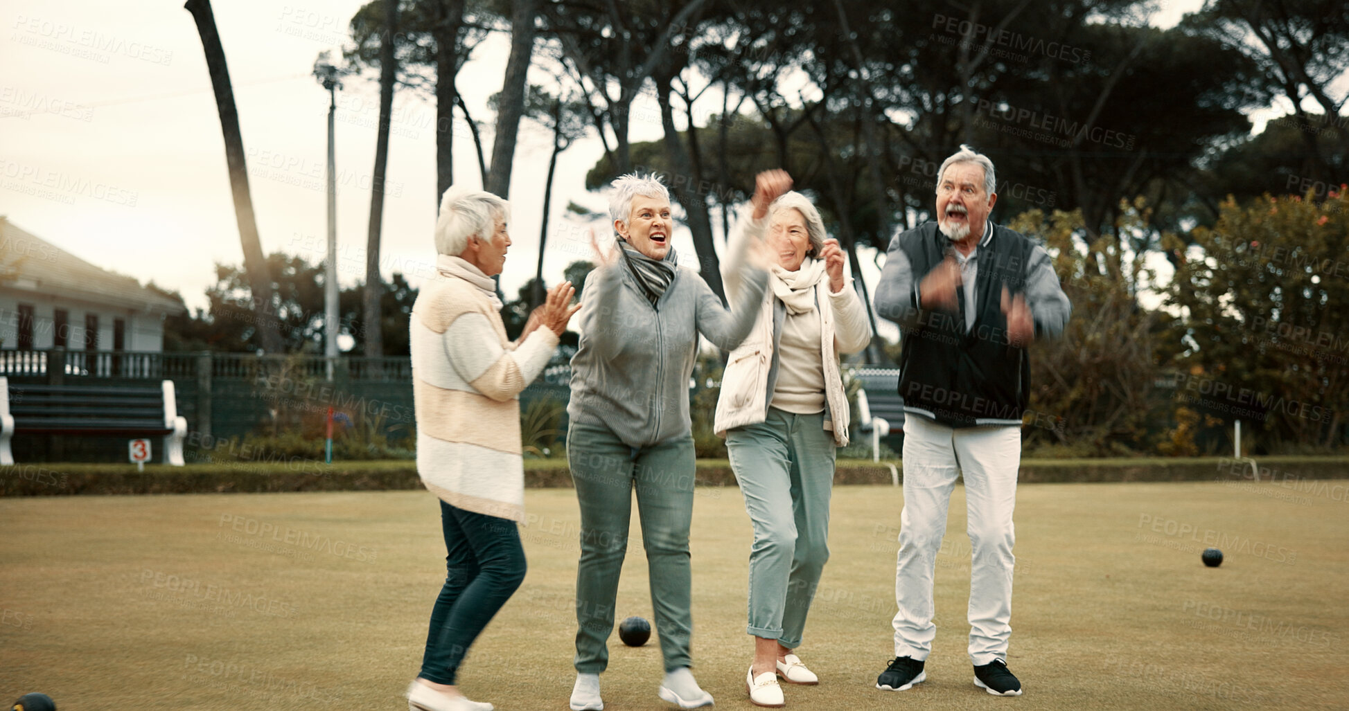 Buy stock photo Bowls, celebration and hugging with senior friends outdoor, cheering together during a game. Motivation, support or applause and a group of elderly people clapping while having fun with a hobby