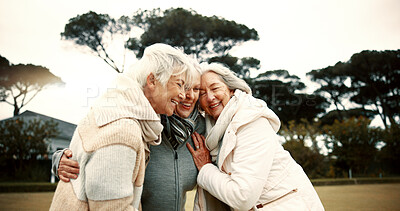 Talking, laughing and elderly woman friends outdoor in a park together for bonding during retirement. Happy, smile and funny with a group of senior people hugging in a garden for humor or fun