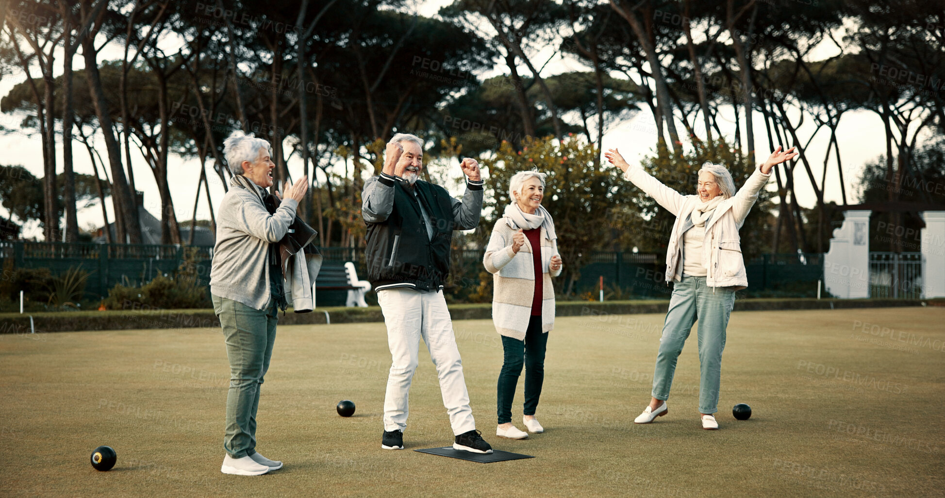 Buy stock photo Bowls, applause and celebration with senior friends outdoor, cheering together during a game. Motivation, support or community and a group of elderly people cheering while having fun with a hobby