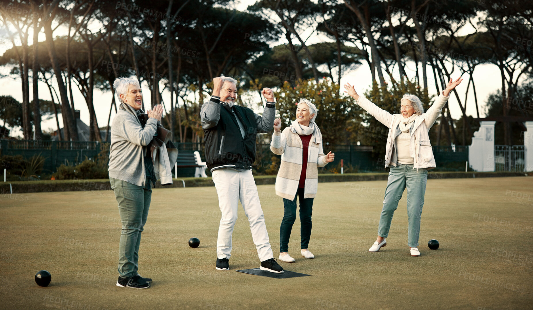 Buy stock photo Bowls, high five and celebration with senior friends outdoor, cheering together during a game. Motivation, support or applause and a group of elderly people cheering while having fun with a hobby