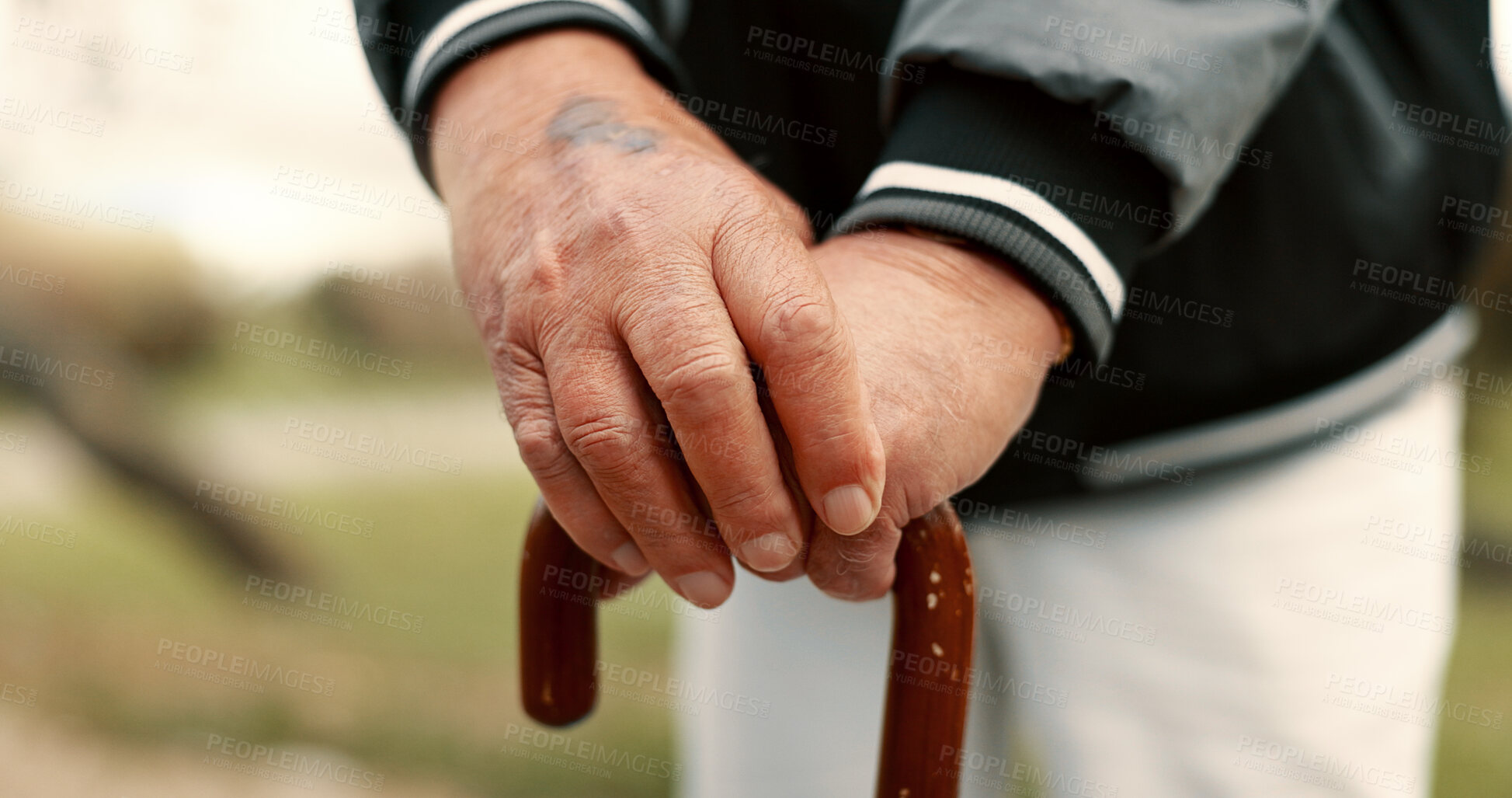 Buy stock photo Hands, cane and elderly man in nature for walking for fresh air, exercise or peace in a park. Environment, closeup and senior male person in retirement with a stick for support in outdoor garden.