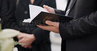 Bible, funeral and hands reading of a priest for religion, sad and mourning event in church. Faith, male person and spiritual passage with worship and book for grief with support and condolences