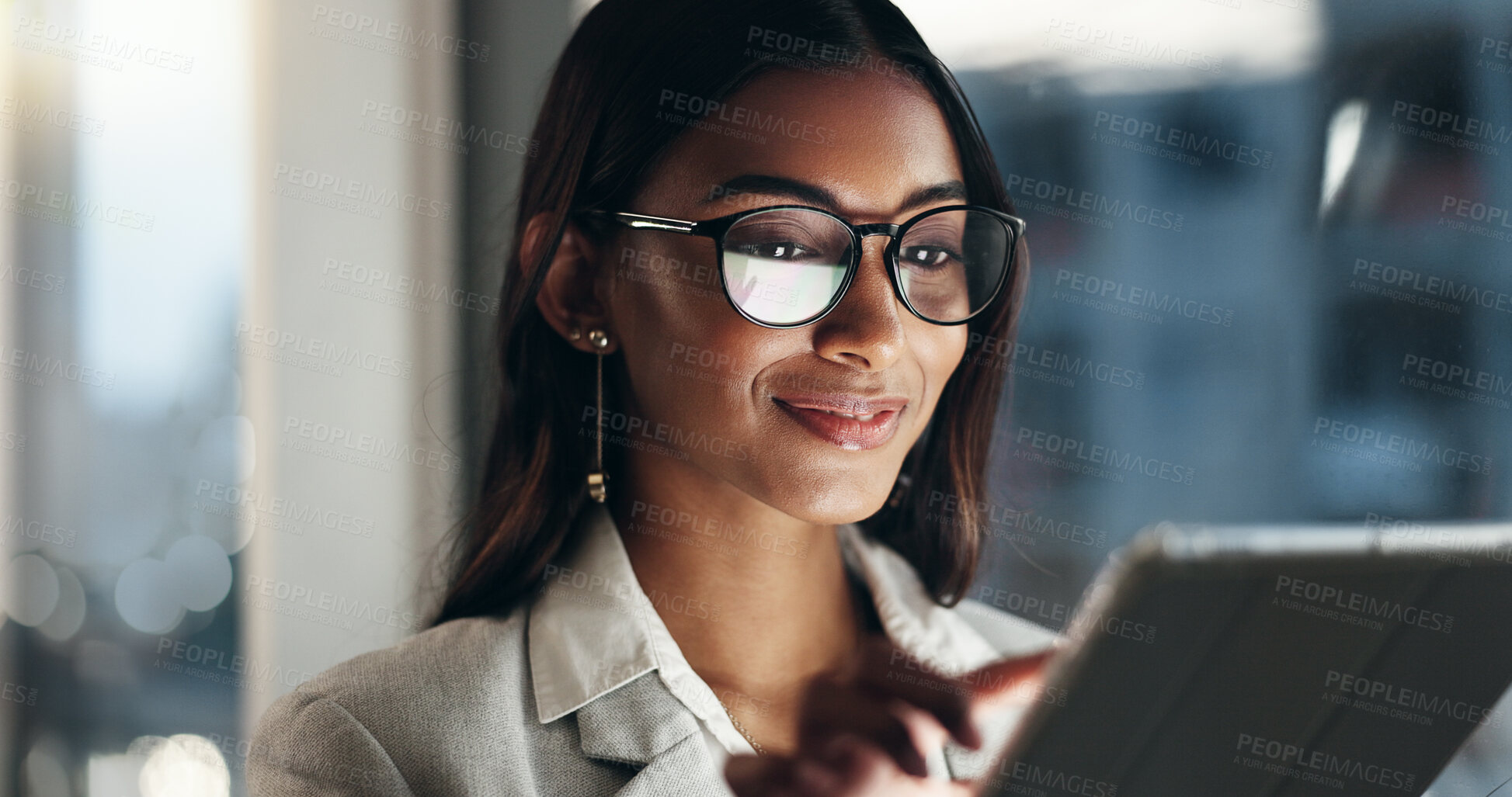 Buy stock photo Tablet, overtime and happy woman in office with glasses, reflection with planning and website. Vision, smile and businesswoman typing email, late at night work and research on future ideas for agency