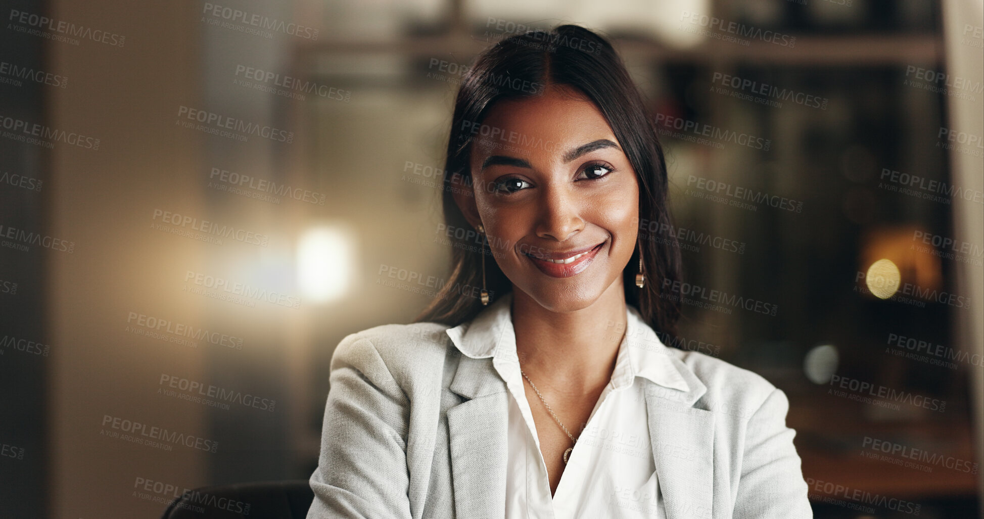 Buy stock photo Happy, night and face of professional woman, office consultant or lawyer happy for overtime work, commitment or career. Pride, corporate portrait and Indian person working late in company law firm
