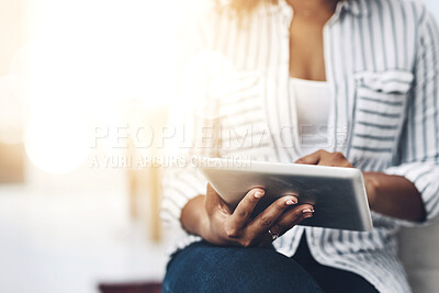 Buy stock photo Tablet technology in the hands of a woman browsing social media, surfing the internet or chatting online with flare and copyspace. Closeup of a female sending an email message or reading news