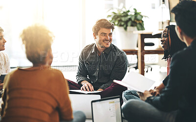Buy stock photo Creative business team in a meeting planning and brainstorming together while sitting on the floor. A group of colleagues or coworkers talking and discussing company ideas in a modern office