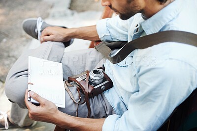 Buy stock photo Man, photographer and camera with map outdoor for travel, direction or location for explore in nature. Person, photography or paper on bench for adventure, journey or tourist with exploration or trip