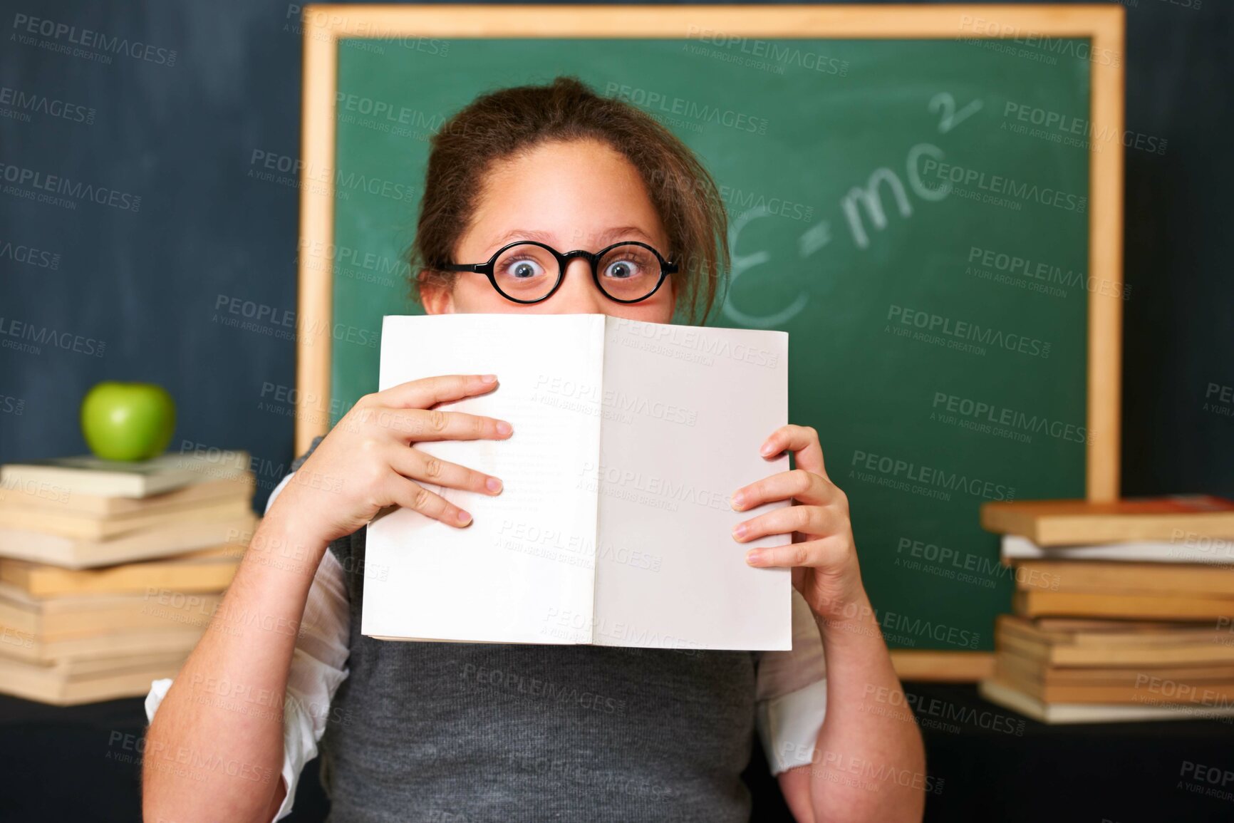 Buy stock photo Shock, reading and portrait of child with a book in the classroom for education, learning or knowledge. Study, nerd and girl kid with glasses enjoying a story or novel with surprise face at school.