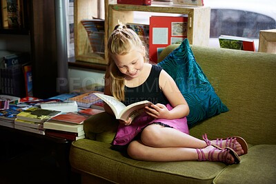 Buy stock photo Child, happy portrait and reading book for learning, education and story, knowledge or creative mindset. Kid or girl relax on couch with literature, English language or library for home development
