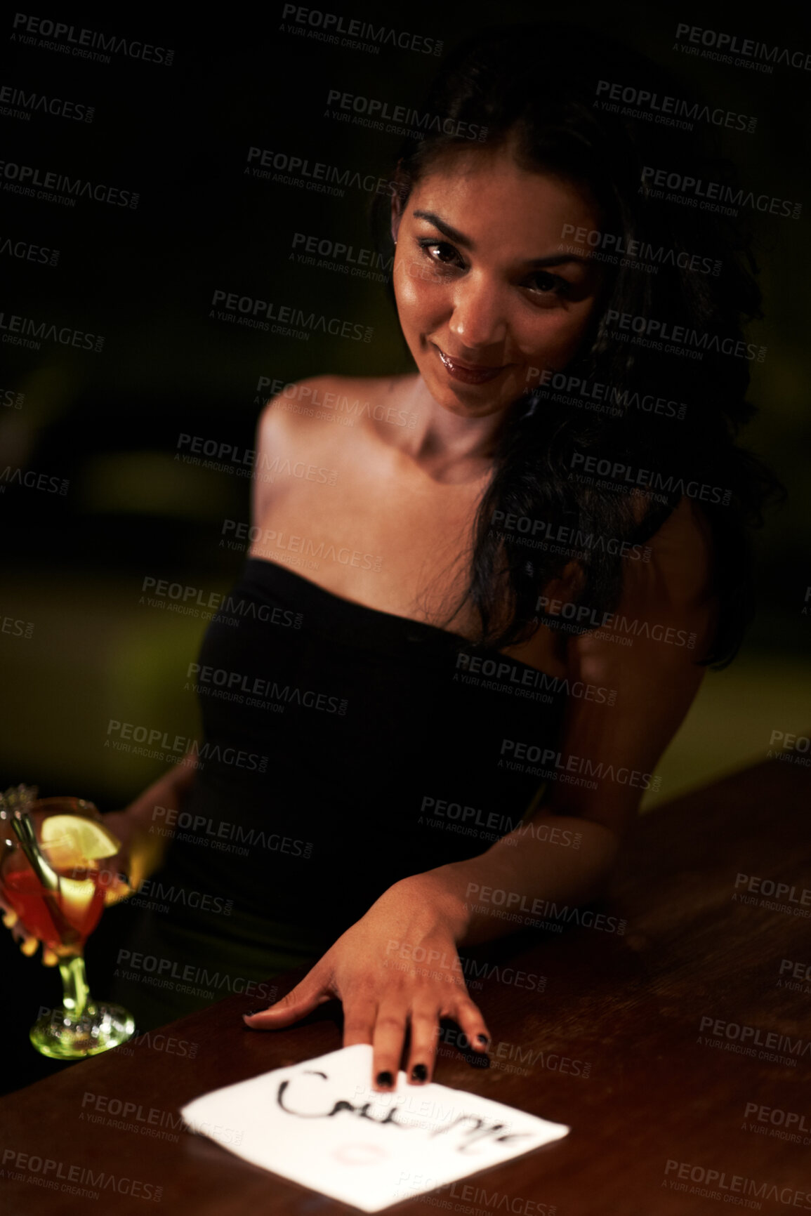Buy stock photo Woman, call me and flirt with lipstick on napkin, seduce and sexy or message for bartender. Brazilian female person, alcohol and drunk or tipsy, outdoors and smiling at night, event and party 