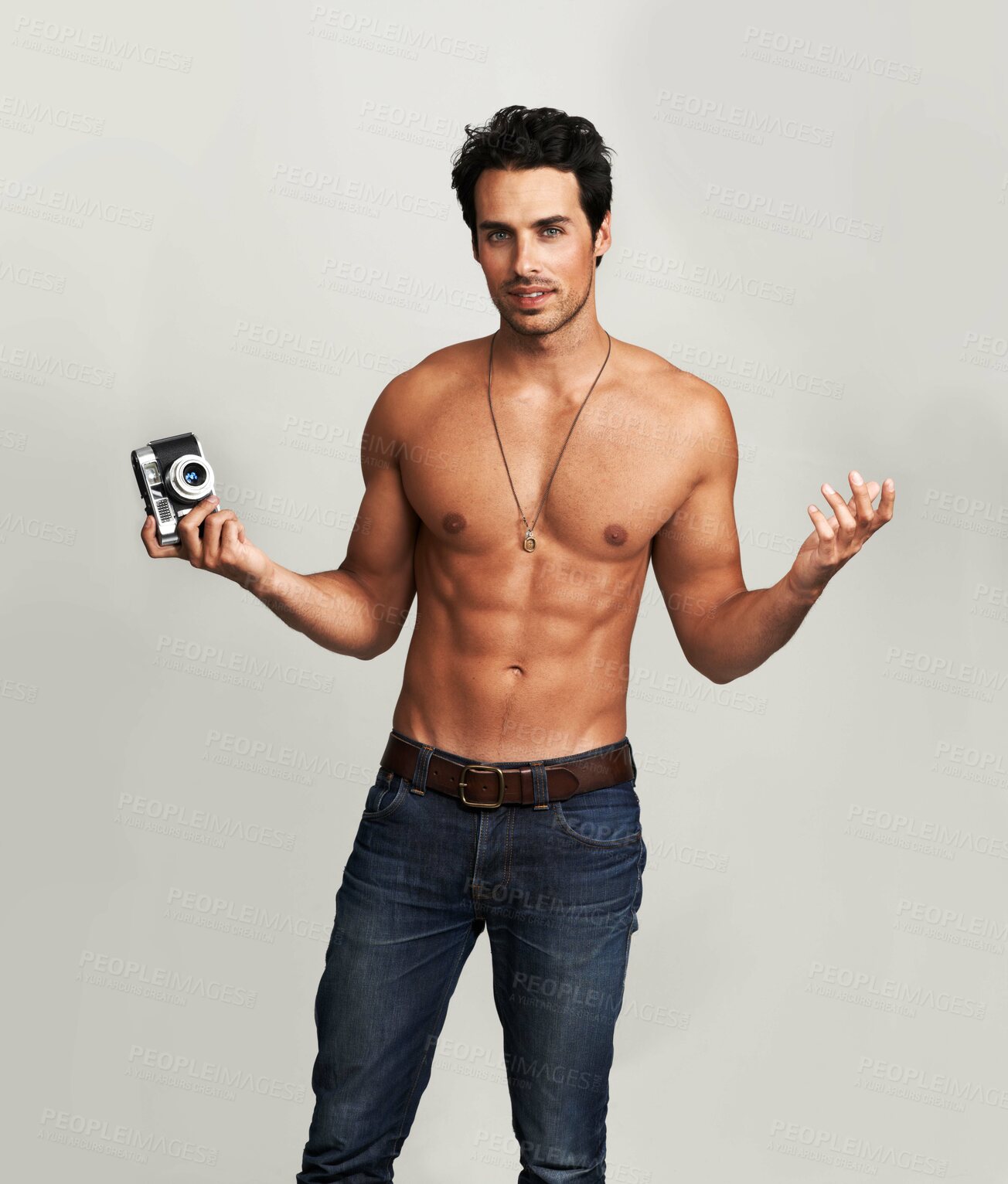 Buy stock photo Camera, shirtless and portrait of man in a studio with art, creative and photography career. Confused, doubt and young male photographer from Canada with dslr equipment isolated by gray background.
