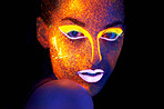 Portrait, beauty and fantasy with neon woman on black background for makeup, glitter or colorful glow. Face, art and creative with confident young person in the dark for psychedelic or techno paint