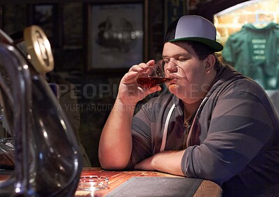 Buy stock photo Man in pub, beer and drinking alone, plus size and depressed with alcohol, mental health or life mistake. Body image crisis, angry or sad with alcoholic beverage in glass, frustration and loneliness