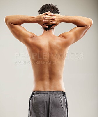 Buy stock photo Back, topless or man for fitness results, wellness and health isolated on grey background in studio. Hands up, model or male person with progress in exercise, workout and training on a backdrop alone