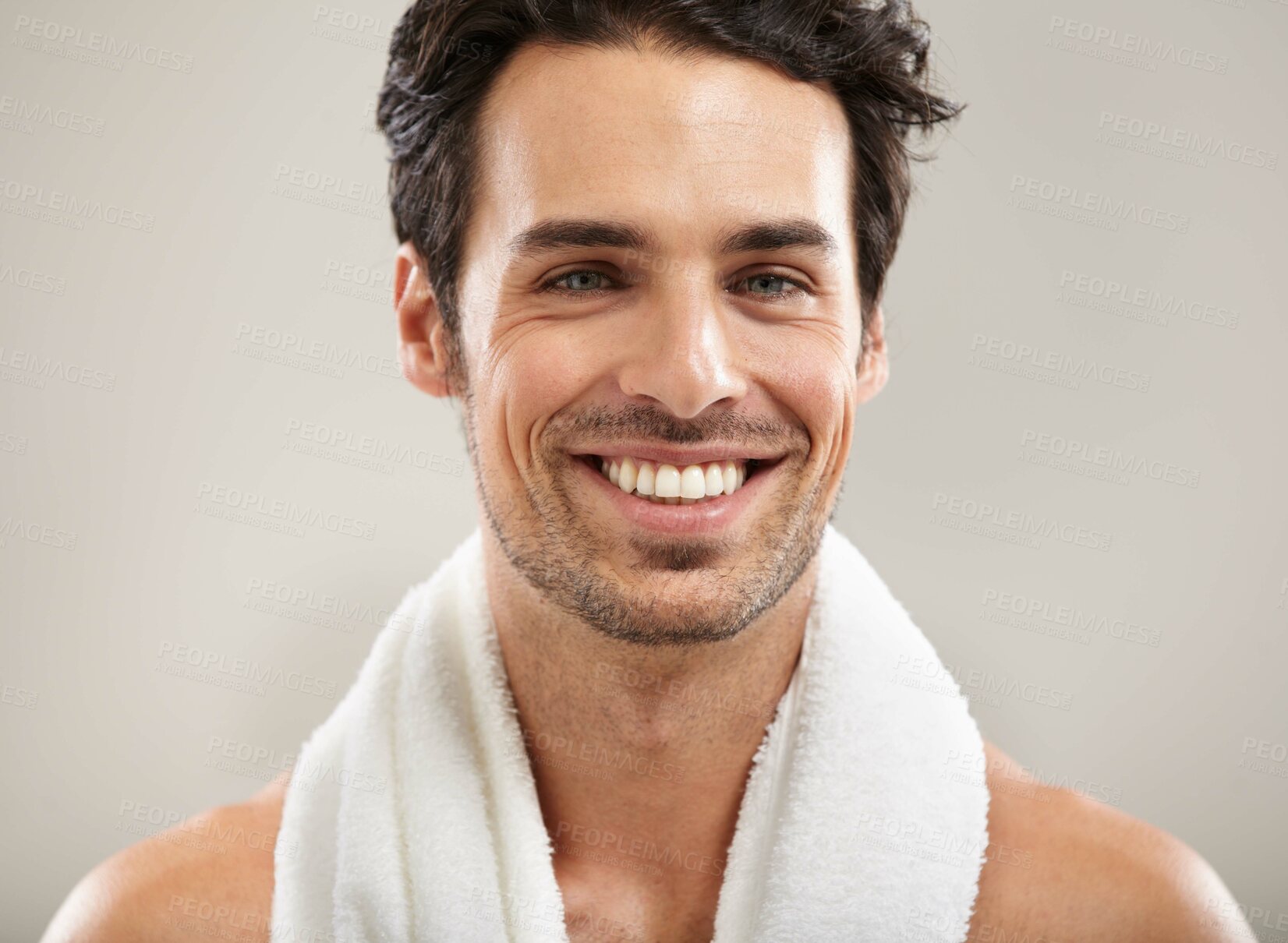 Buy stock photo Towel, portrait or happy man in studio for fitness workout, sports exercise or healthy wellness. Smile, grey background or model athlete ready to start training with confidence, discipline or pride