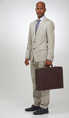 Buy stock photo Black businessman, portrait and smile by briefcase in studio, confident and law career as attorney. African man, face and positive in formal fashion for lawyer and professional by white background