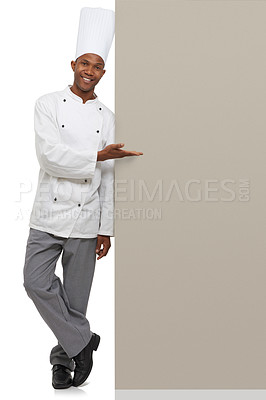 Buy stock photo Poster, portrait and black man chef with hand pointing to studio for checklist, menu or space on white background. Bakery, presentation or baker face with food tips billboard, guide or steps mock up