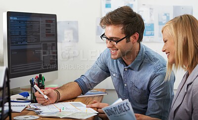 Buy stock photo Shot of a young couple planning an overseas trip
