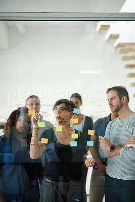 Buy stock photo Manager, leader or boss talking and planning in a workshop, seminar or presentation with sticky notes in a boardroom. Business woman discussing and brainstorming with her colleagues and coworkers