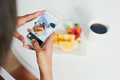 Buy stock photo Shot of an unidentifiable woman taking a picture of her breakfast with her smartphone