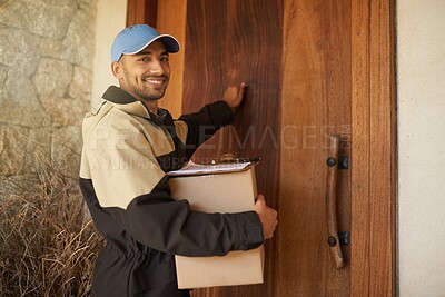 Buy stock photo Portrait of a smiling delivery man holding a package and knocking on a customer's door