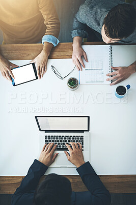 Buy stock photo High angle shot of a group of unrecognisable businesspeople working together in an office
