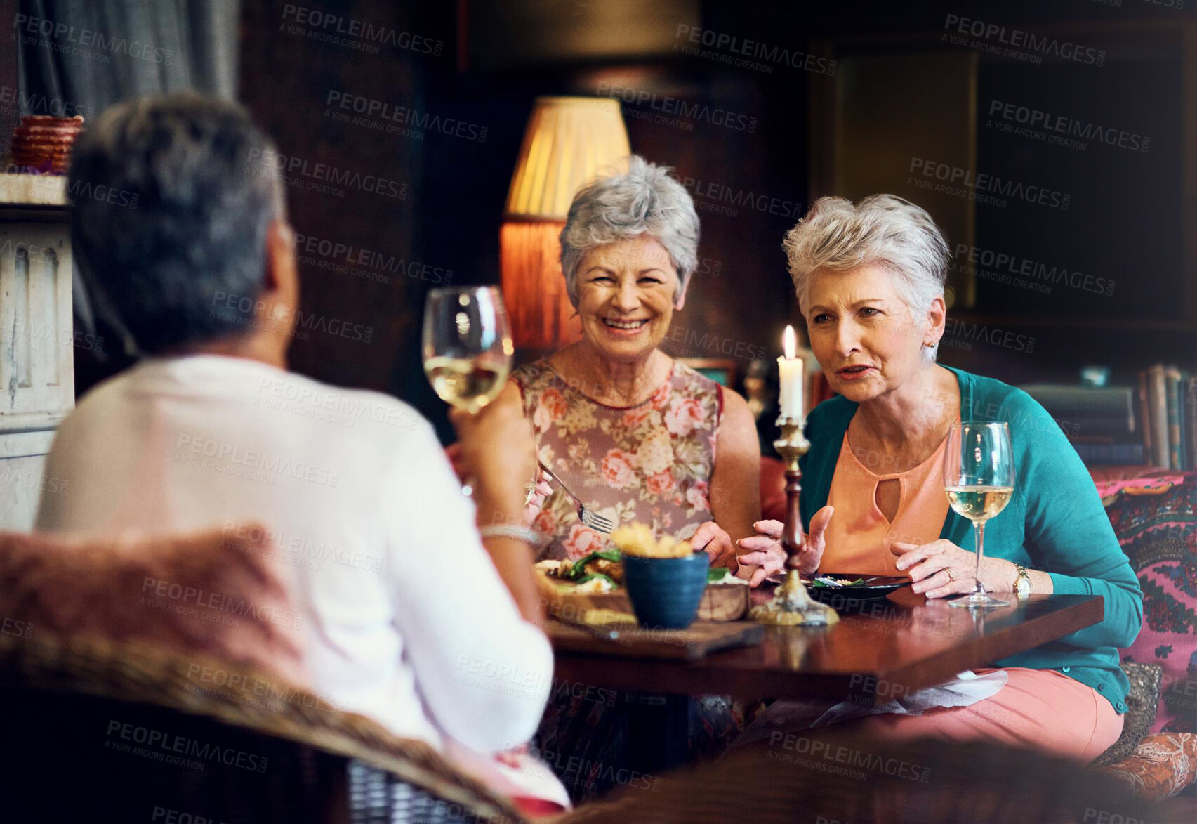 Buy stock photo Conversation, wine and smile with elderly friends in home for bonding, laugh and relax. Retirement, celebration and happiness with senior people and lunch for social, memory and support together