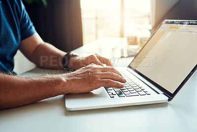 Buy stock photo Cropped shot of an unrecognizable male designer working on a laptop in his office